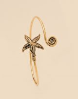 Bracelet en laiton doré avec spirale et étoiles de mer