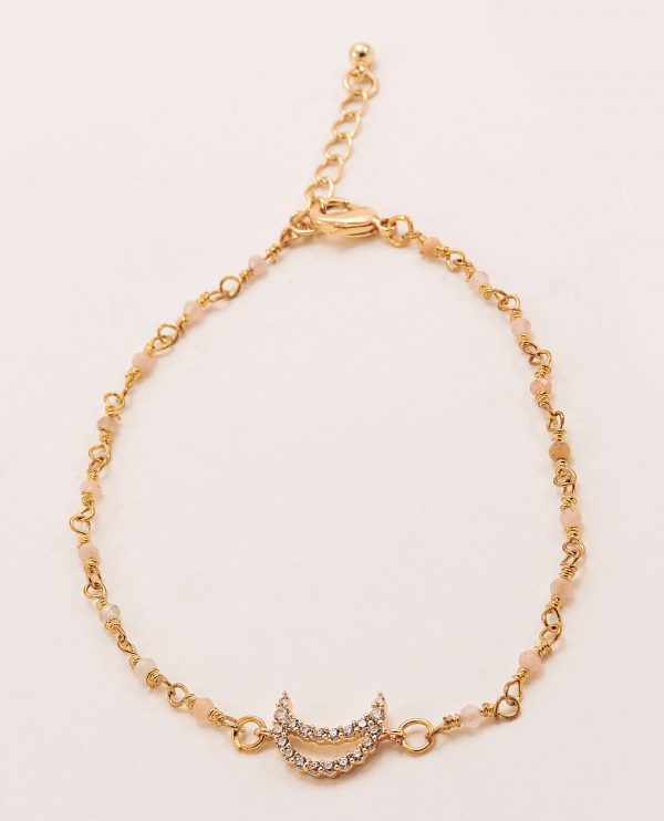 Bracelet laiton doré avec perles roses pales et symboles lune avec strass