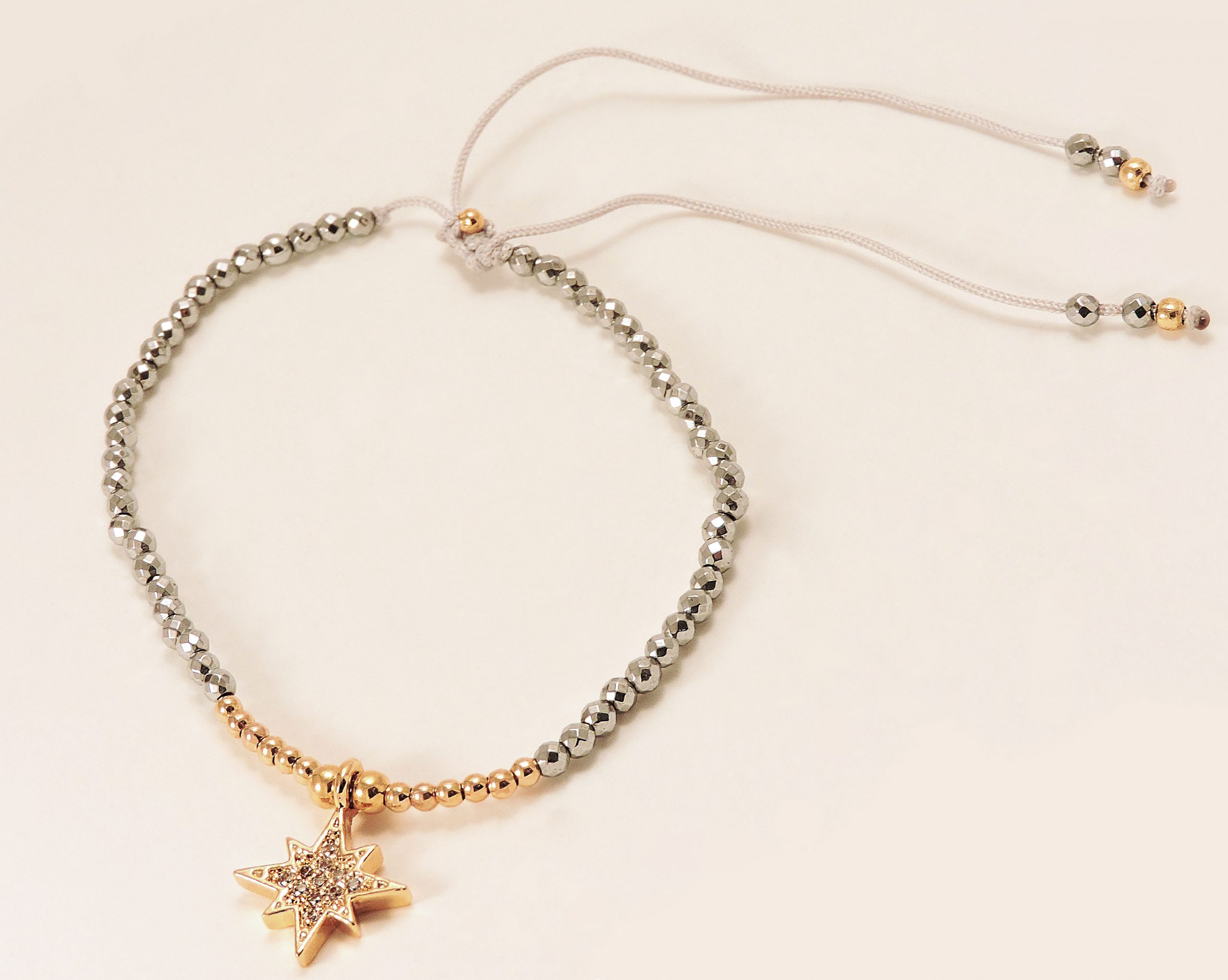 Bracelet doré et argenté avec breloque étoile