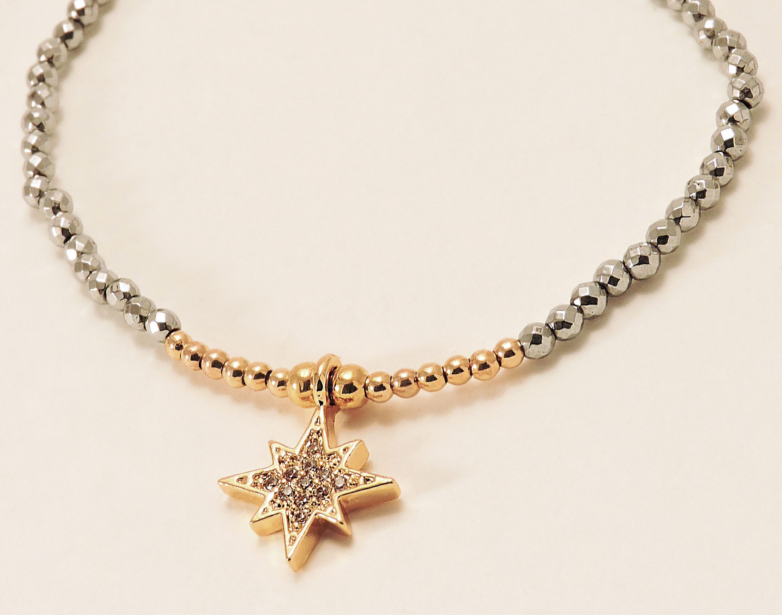 Bracelet doré et argenté avec breloque étoile